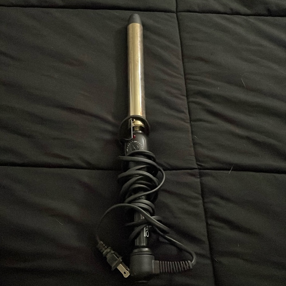 Curling wand, it has some hair spray marks from using it. but in good condition